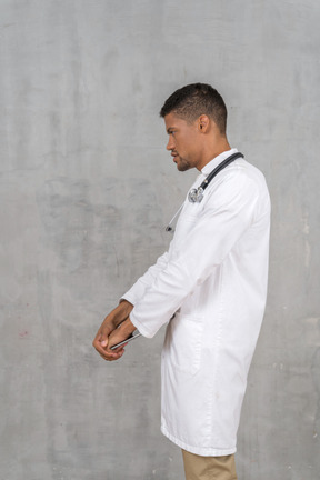 Side view of a doctor standing
