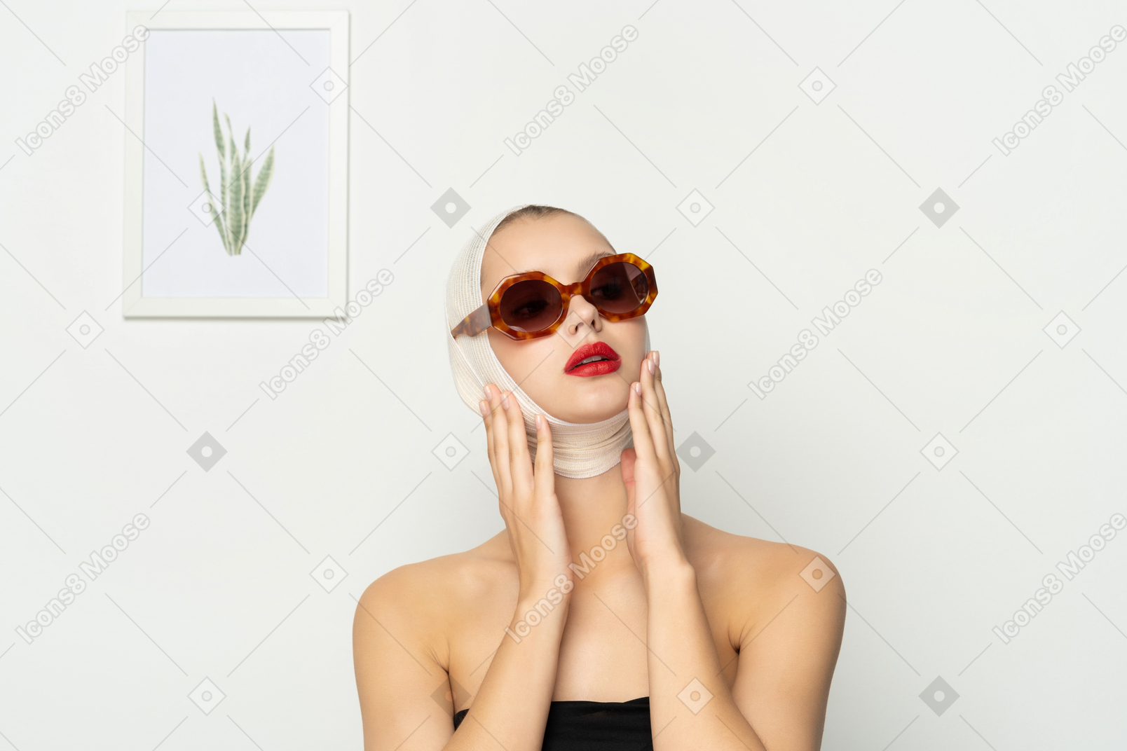 Woman with bandaged head wearing sunglasses
