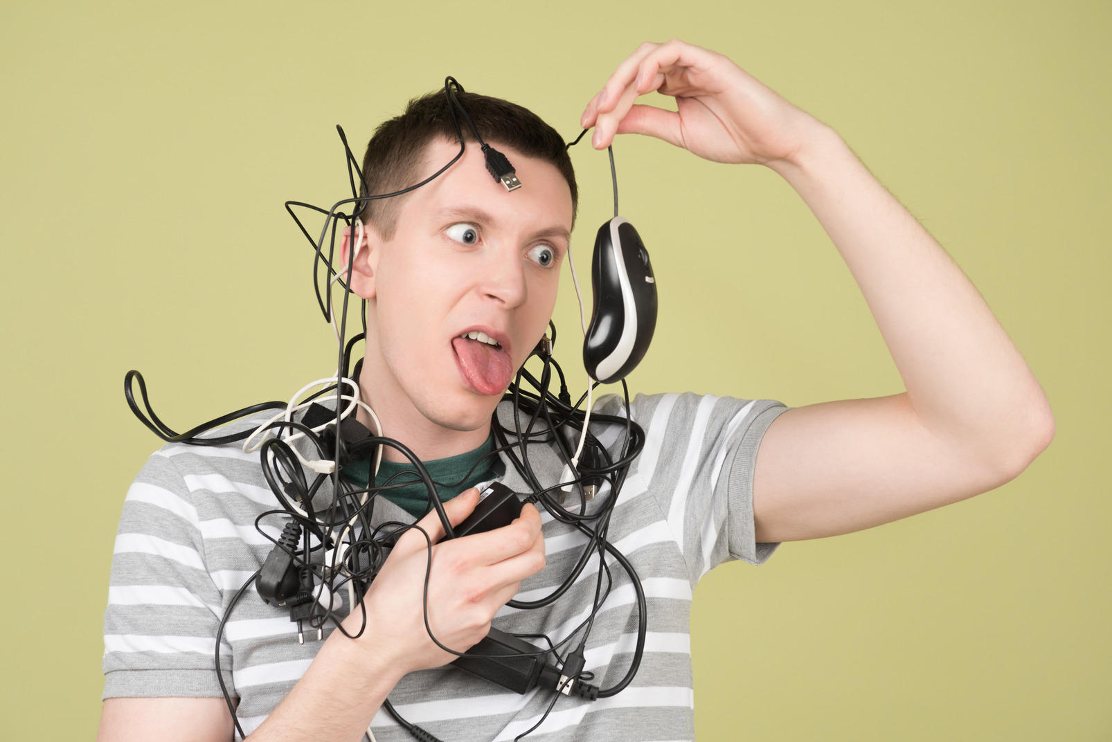 Young man tangled in wires