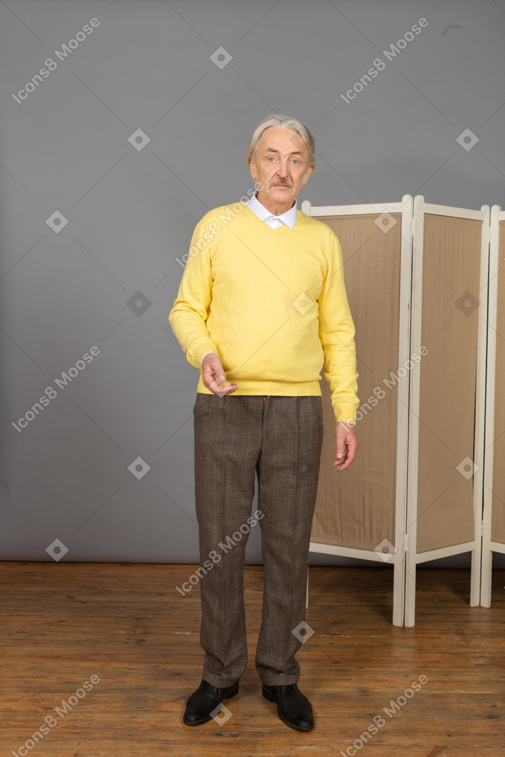 Front view of a serious old man looking at camera