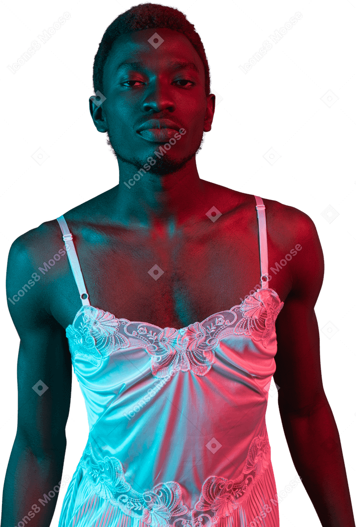 Young black man in white nightie looking at camera