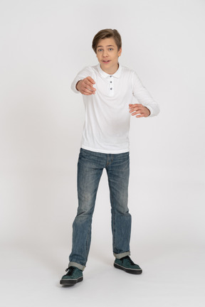 Young man in casual clothes standing