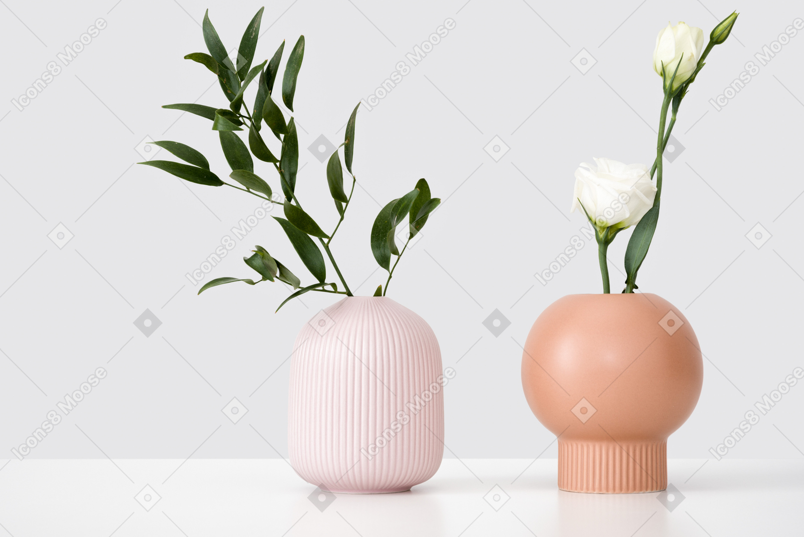 Ceramic vases with green branch and white eustoma
