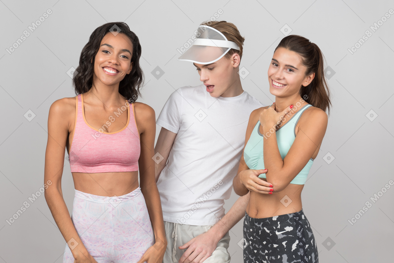 Guy standing in company of friends and checking out out his friend's abs