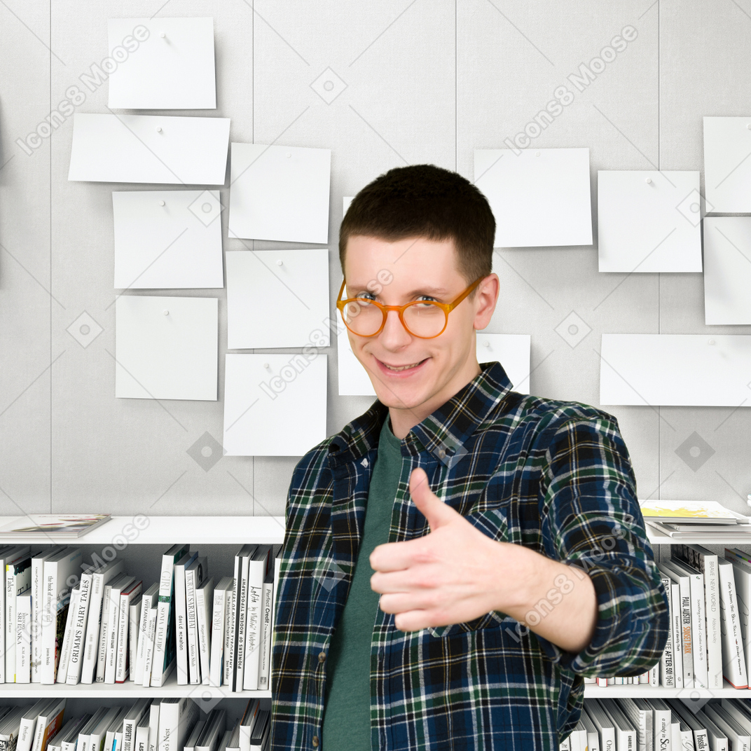 A man in a plaid shirt standing in front of a wall of papers