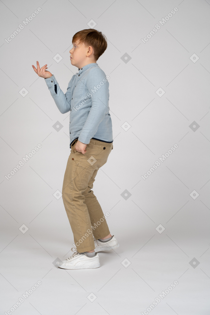 Side view of a little boy gesturing
