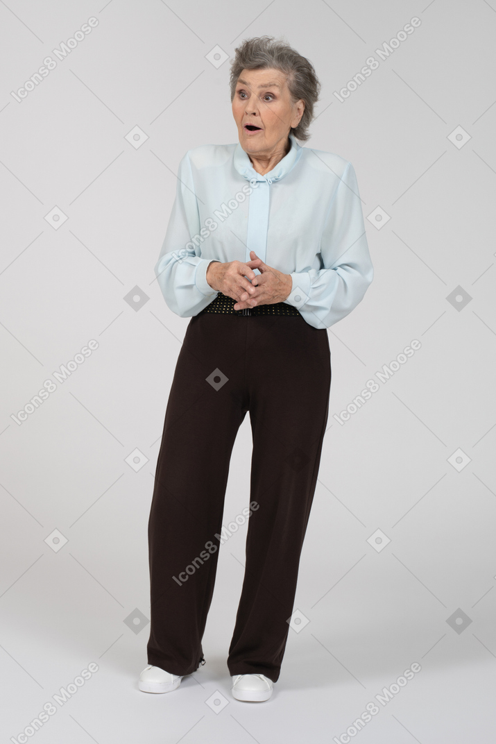 Front view of an old woman looking surprised