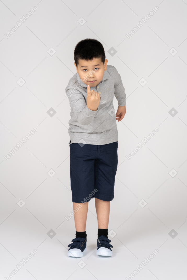 Boy with hand gesture