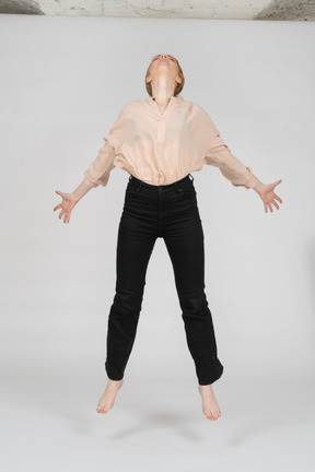 Woman in beautiful blouse jumping