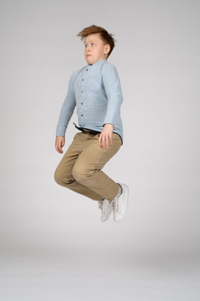 A boy jumping with bent knees