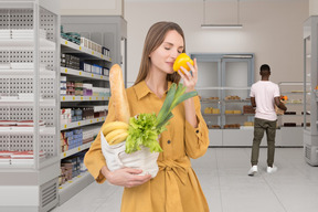 People grocery shopping in a supermarket