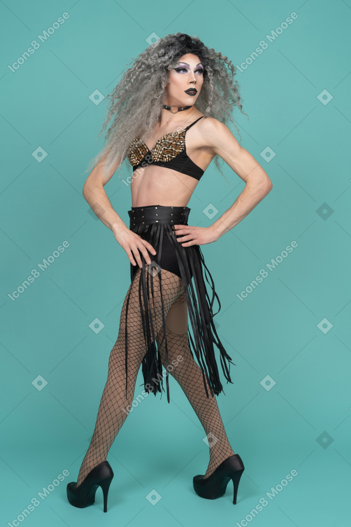 Drag queen looking over shoulder with hand on hip