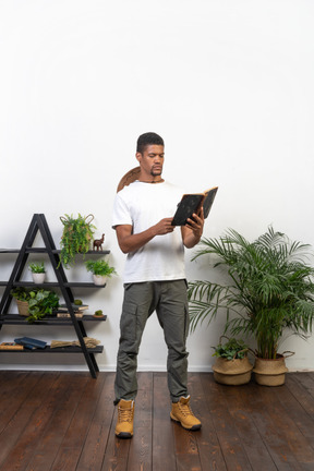 Good looking young man with a book