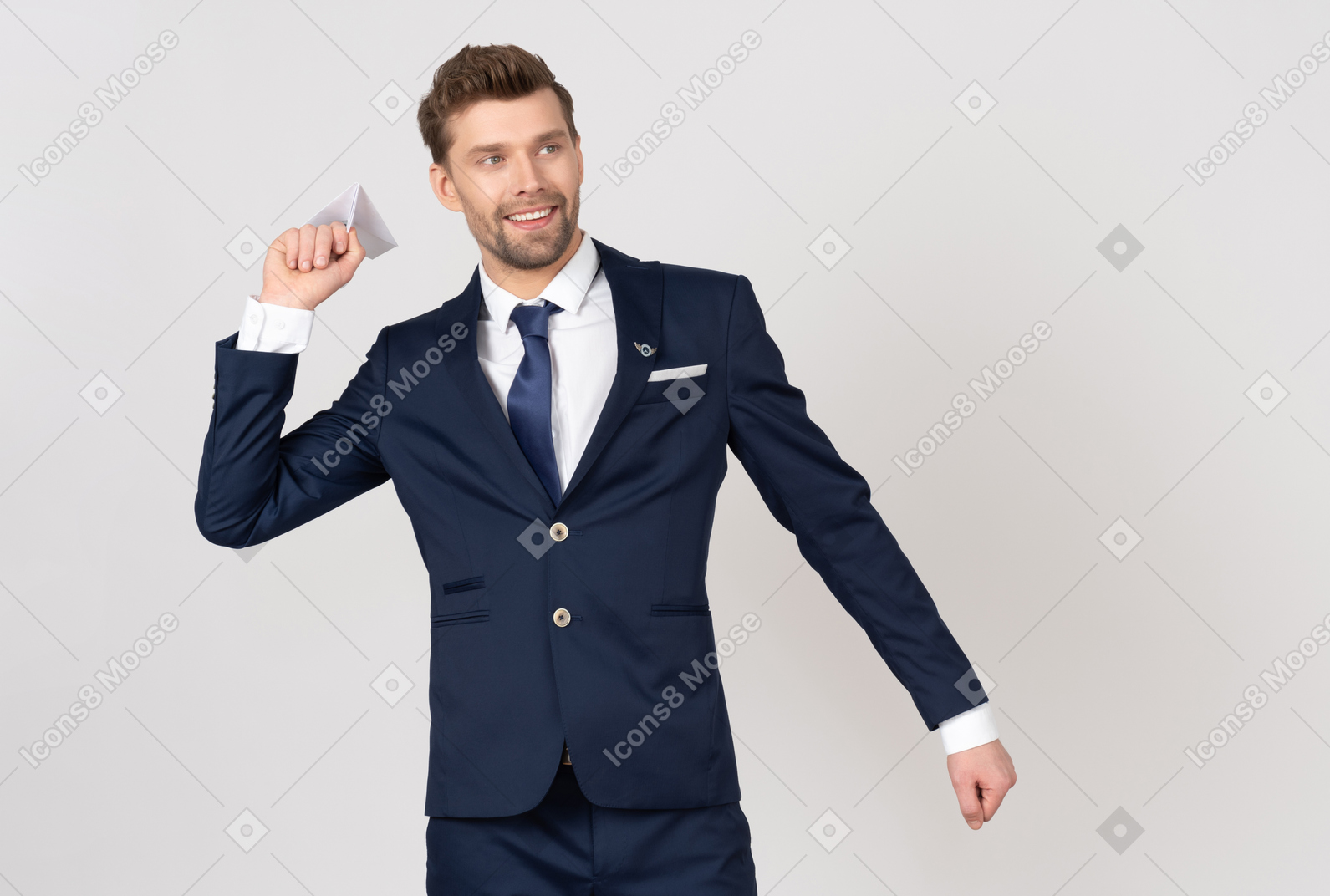 Male flight attendant holding a paper airplane