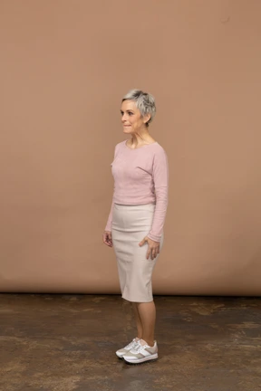 Side view of a woman in casual clothes making faces