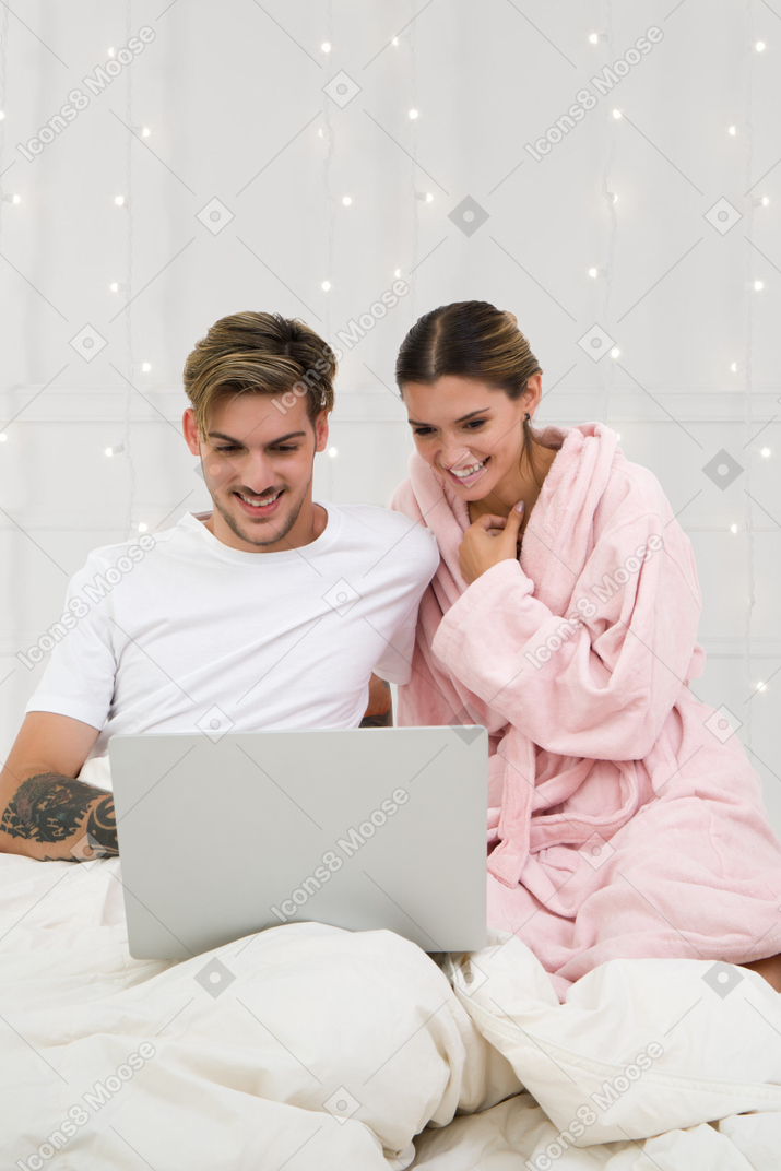 Young couple thinking about gift list