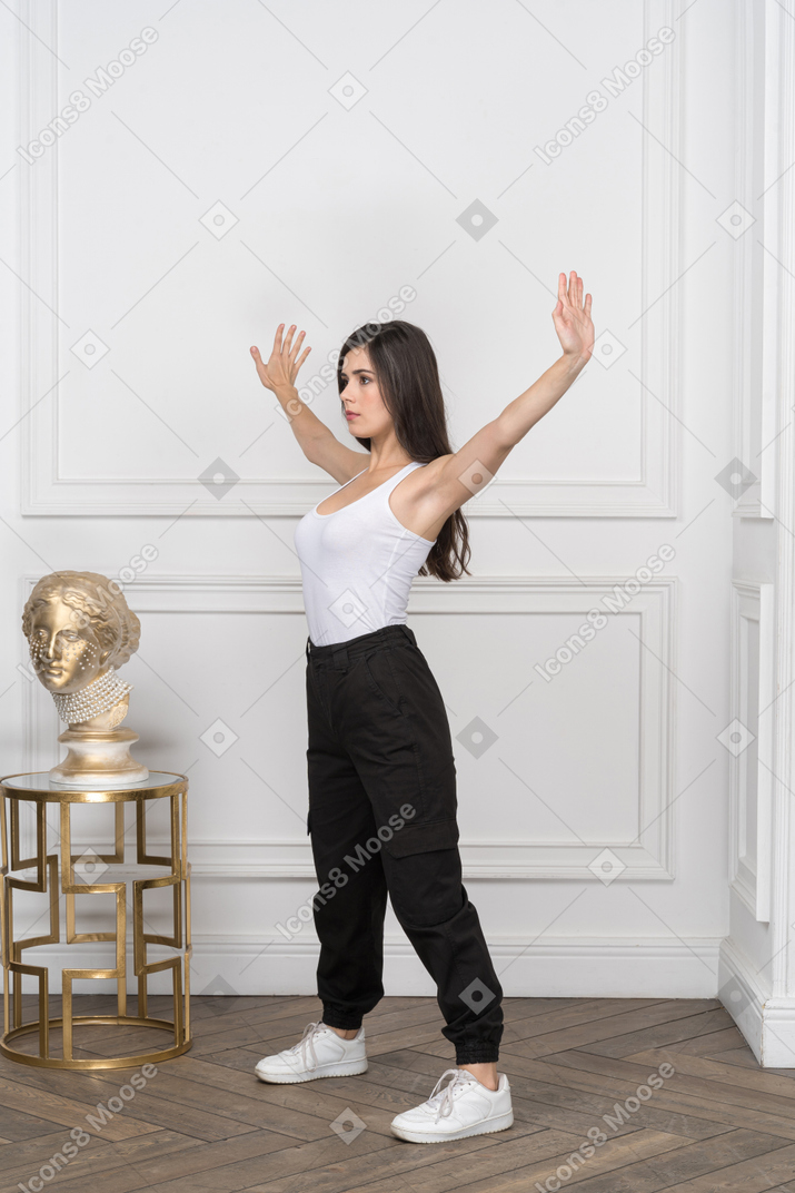 Young woman doing a star pose
