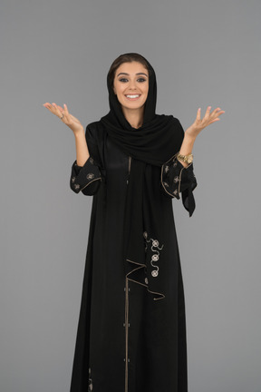 Happy muslim woman gesturing