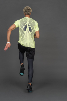 Back view of a man joggin