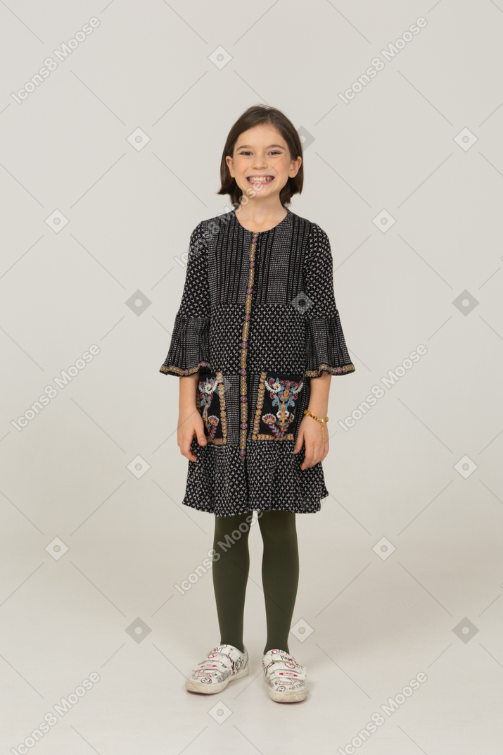 Front view of a smiling little girl in dress