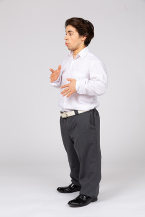 Side view of young man gesturing