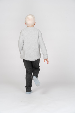 Back view of a boy running
