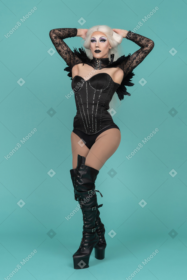 Transvestite posing with hands behind head