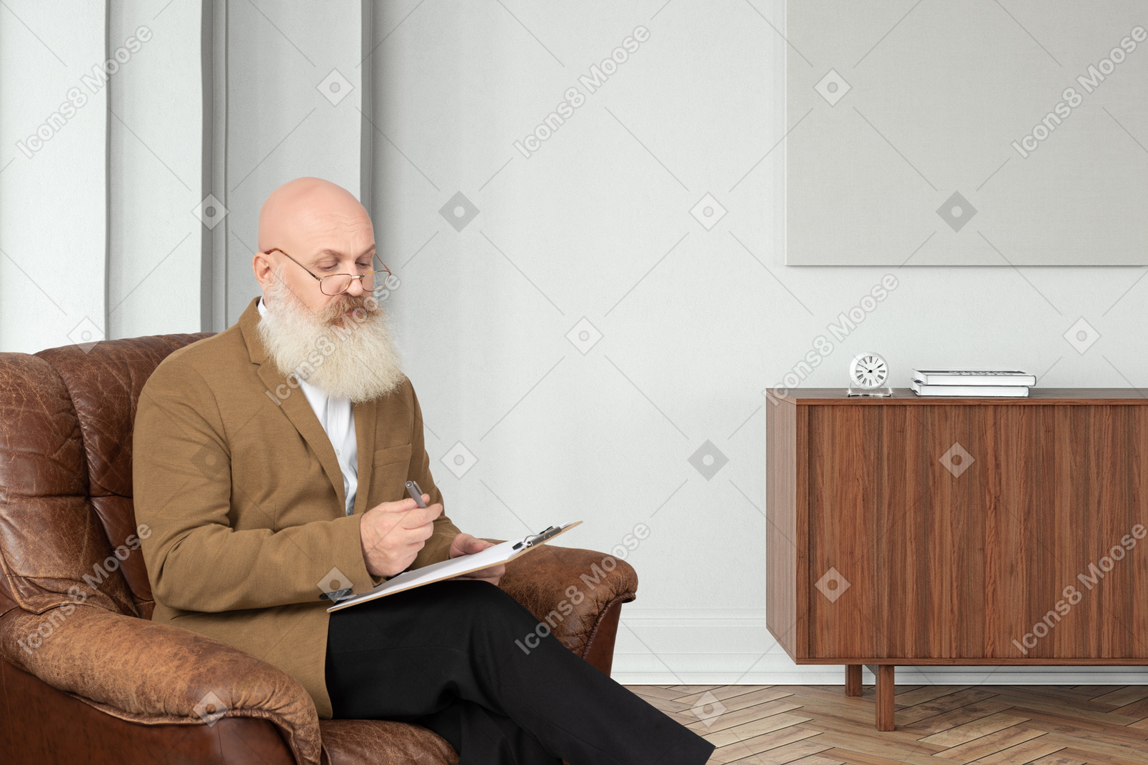 A man sitting on a couch with a laptop