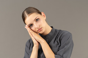 Front view of a young woman in a jumpsuit with clean skin