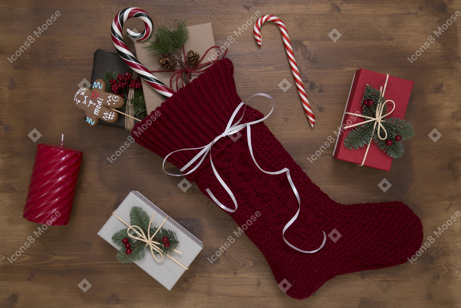 Christmas stocking and gifts on wooden background