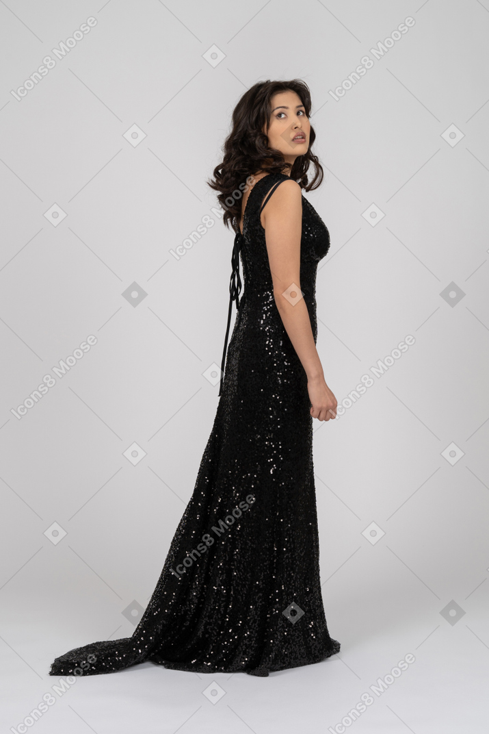 Dreamy woman in black evening dress