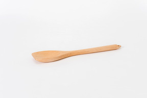 Wooden spoon on white background