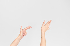 Female hands pointing to the right