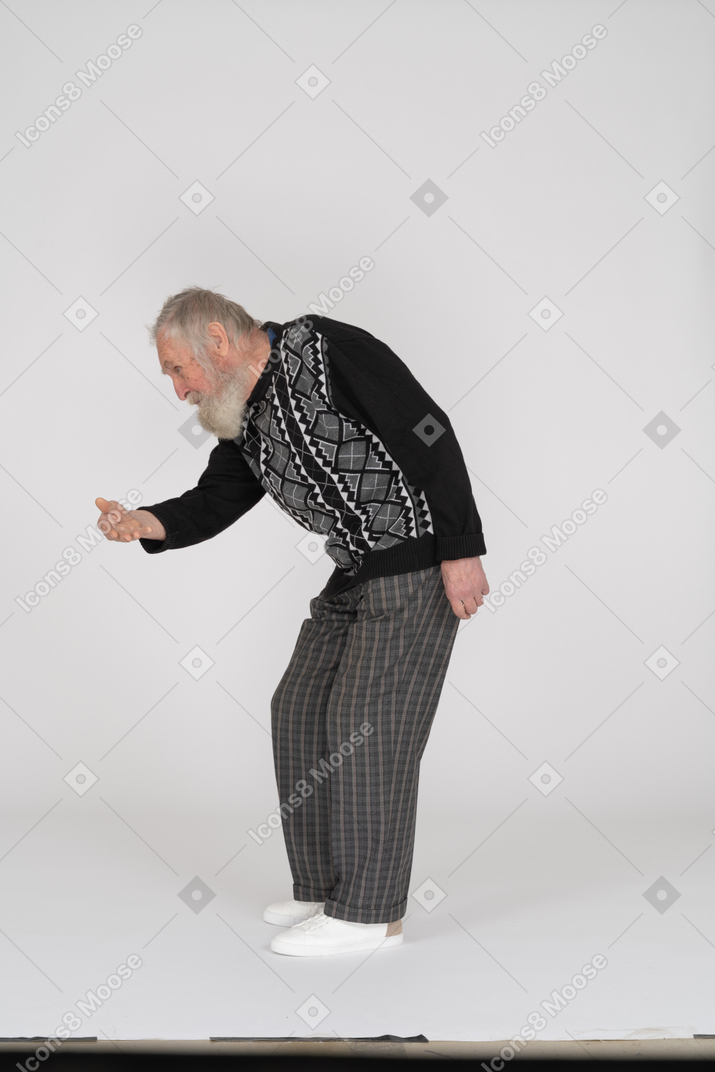Old man bending down and giving way to somebody