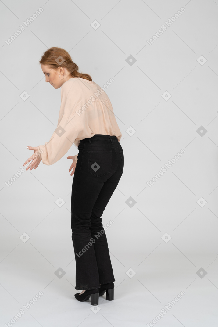 Woman in beautiful blouse standing