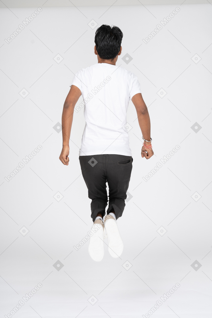 Man in white t-shirt jumping