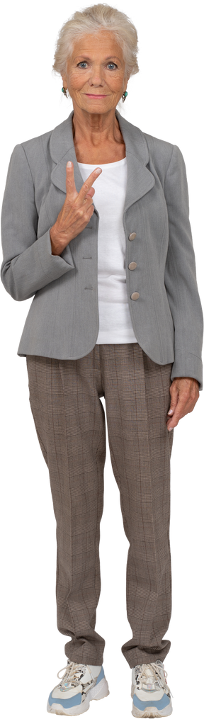 Front view of an old lady in suit showin v sign