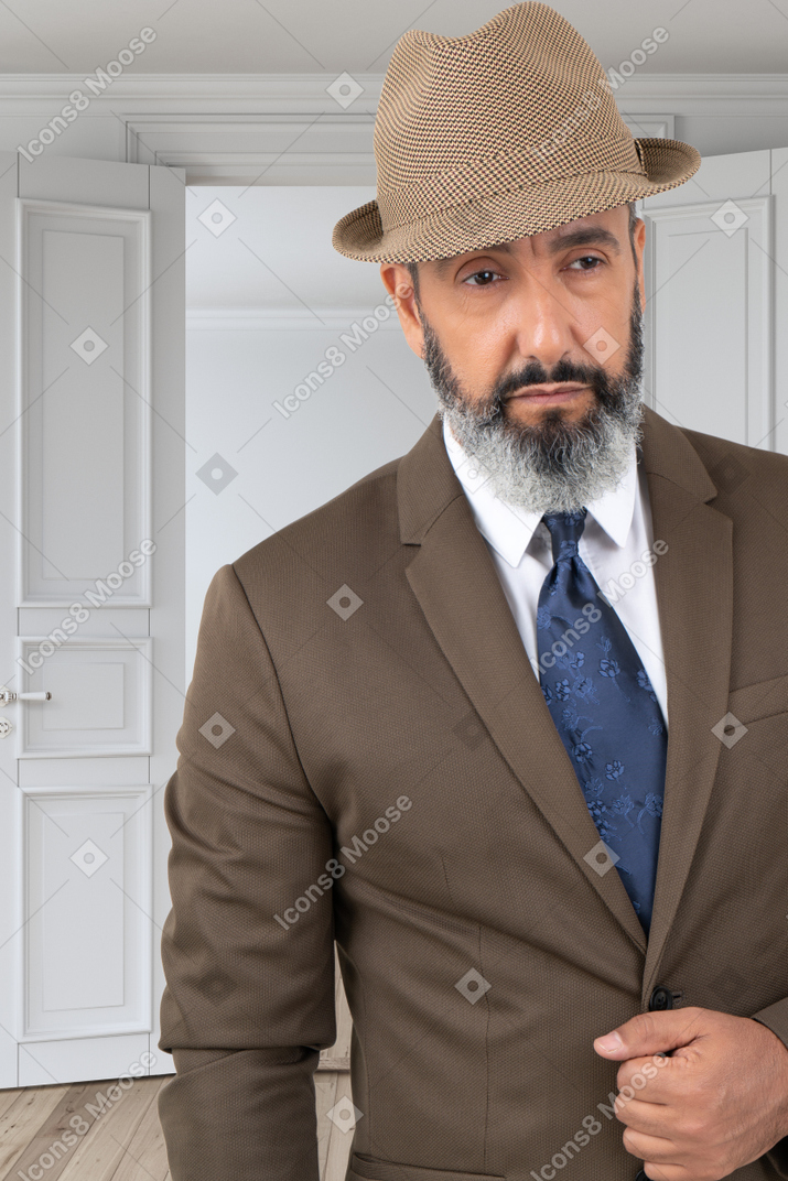 A man with a beard wearing a suit and tie
