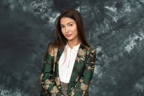 Front portrait of a woman in silk japanese jacket looking aside