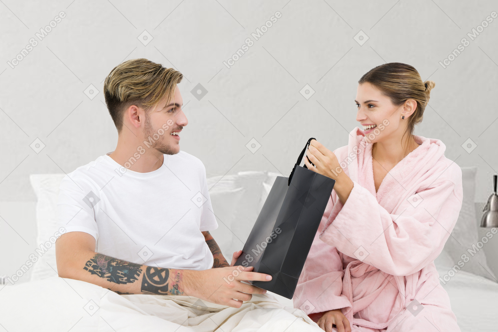 Woman giving man a gift