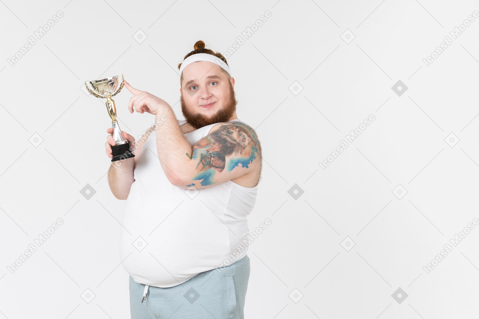 Big guy in sportswear holding a trophy