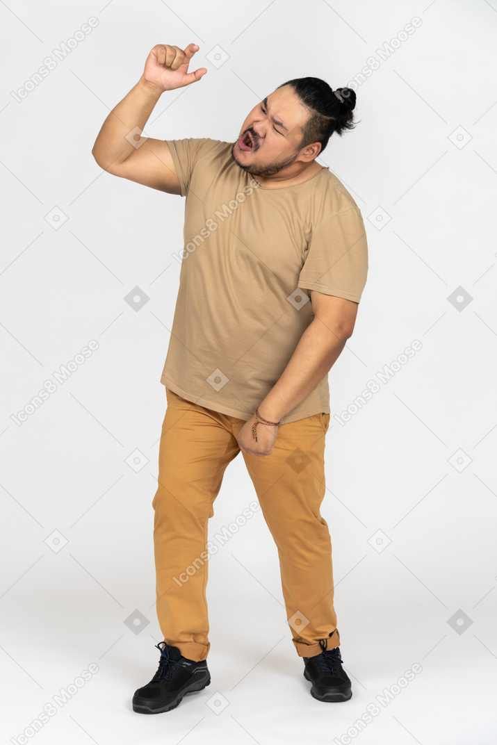 Anxious asian man screaming and gesturing