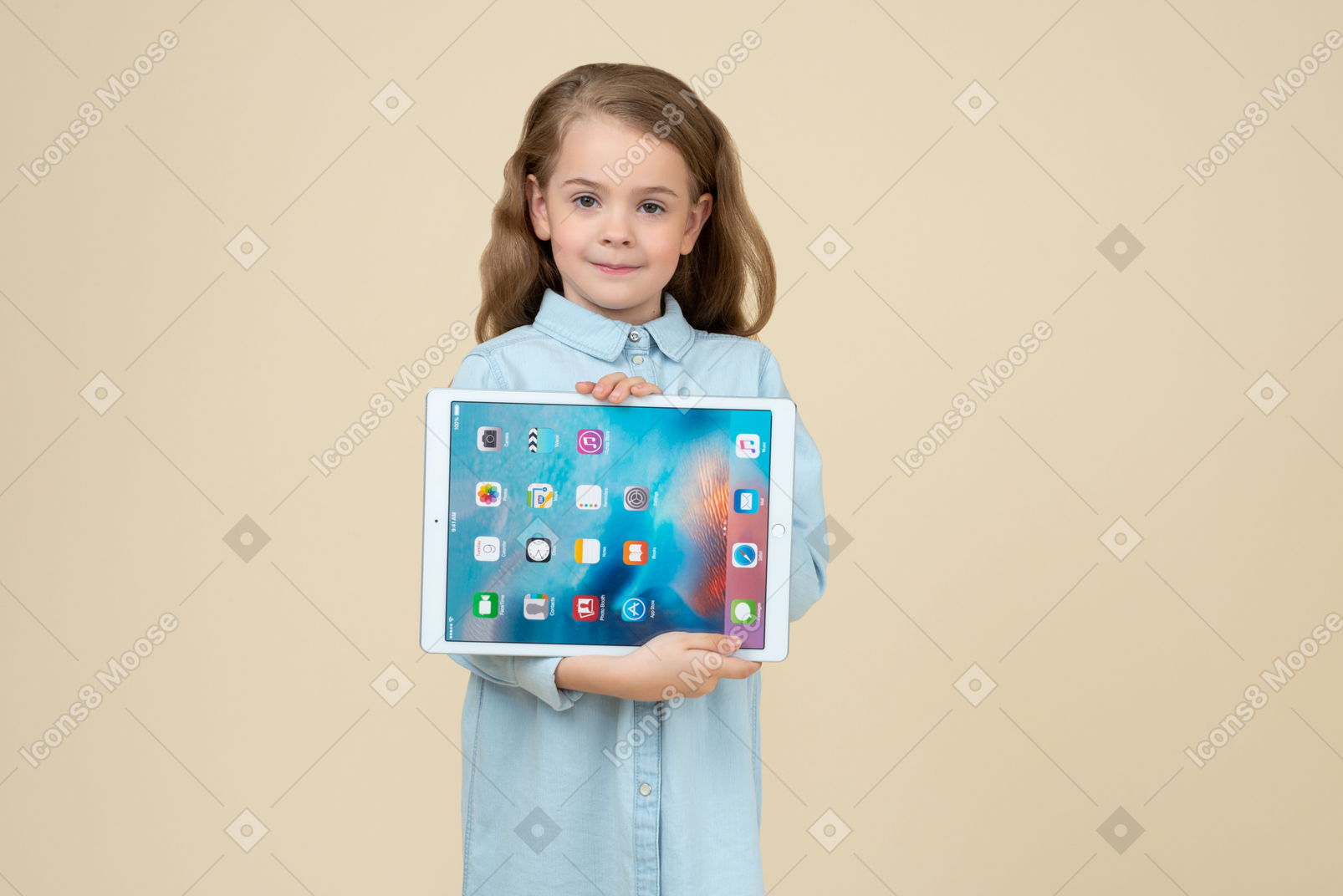 Cute little girl showing a tablet