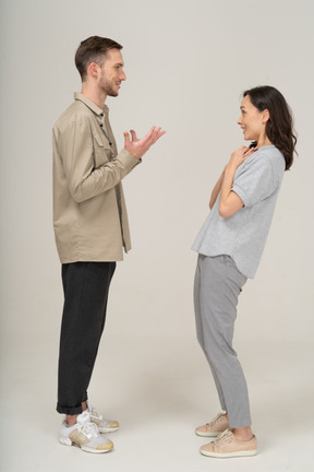 Side view of young couple speaking to each other