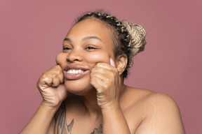 Portrait of a happy apple-cheeked afro woman