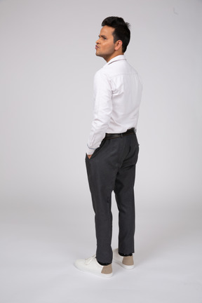 A man in a white shirt and black pants