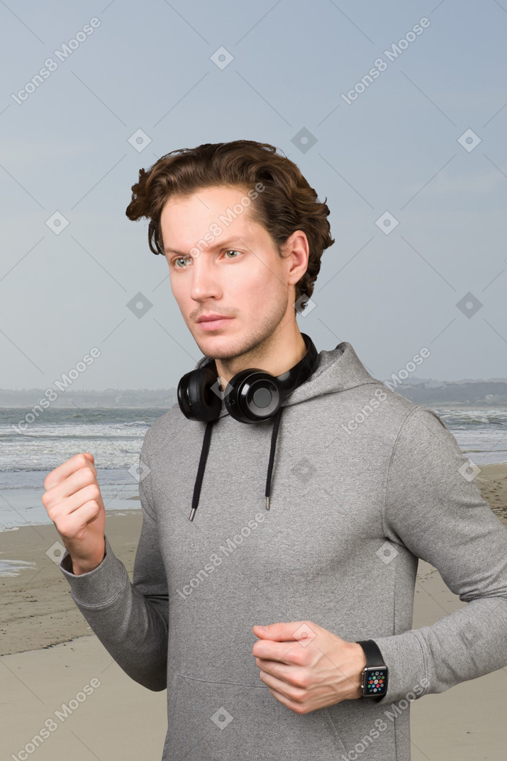 A man jogging on a beach