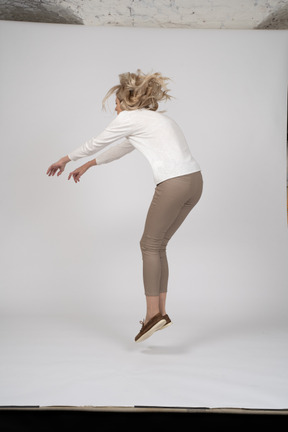 Woman in casual clothes jumping