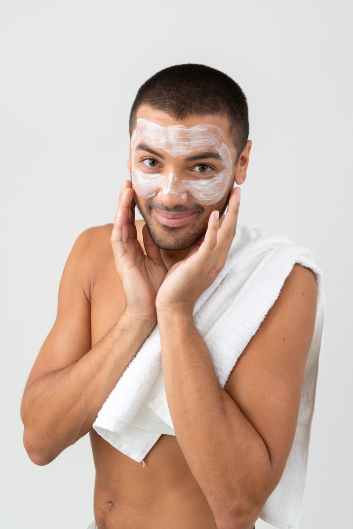 A woman 's face is covered with a towel