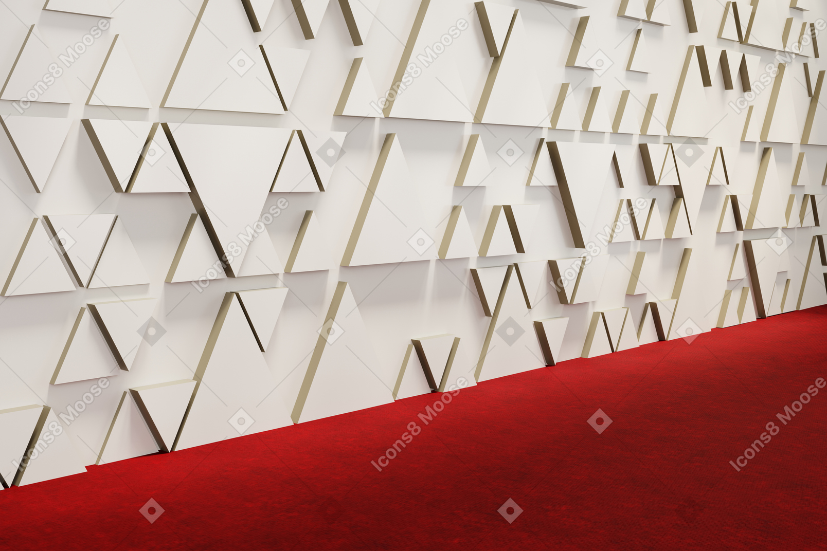 A press wall decorated with triangles and a red carpet below it